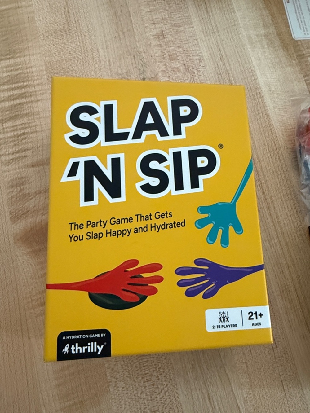 SLAP 'N SIP Party Game - Yellow Box with Colorful Hands
